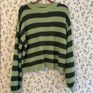 Cozy green striped sweater. It is a bit buggy it looks so good on.